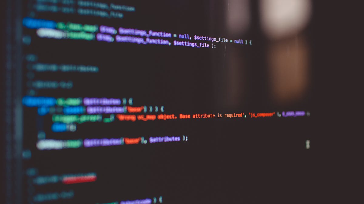 Colorful programming code on a screen, representing business rules and software logic execution